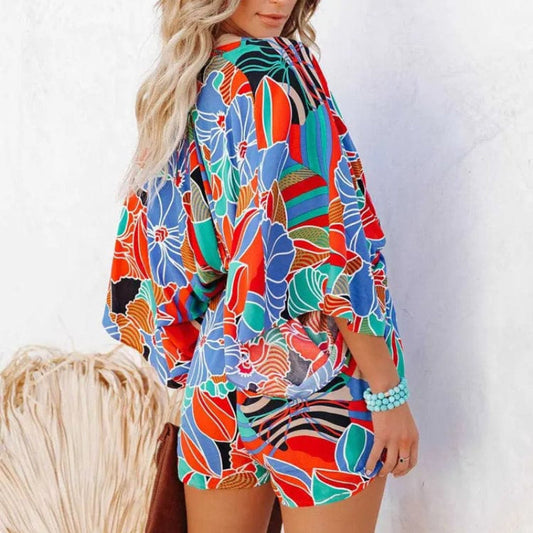 Women's floral print romper | Stylish v-neck summer outfit with wide leg shorts 1