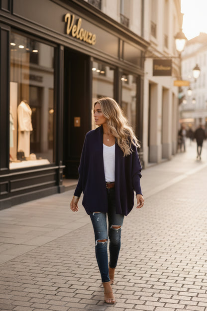 Woman wearing a navy cardigan in a street
